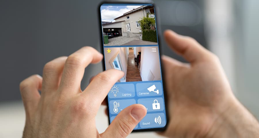 Homeowner looking at video camera feeds on a smartphone